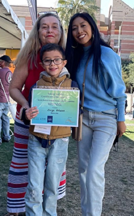 Photo of Dr. Chuc, Ms. Ramirez, and a second grade student.